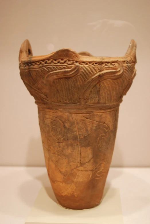 a large vase sitting on display inside of a building