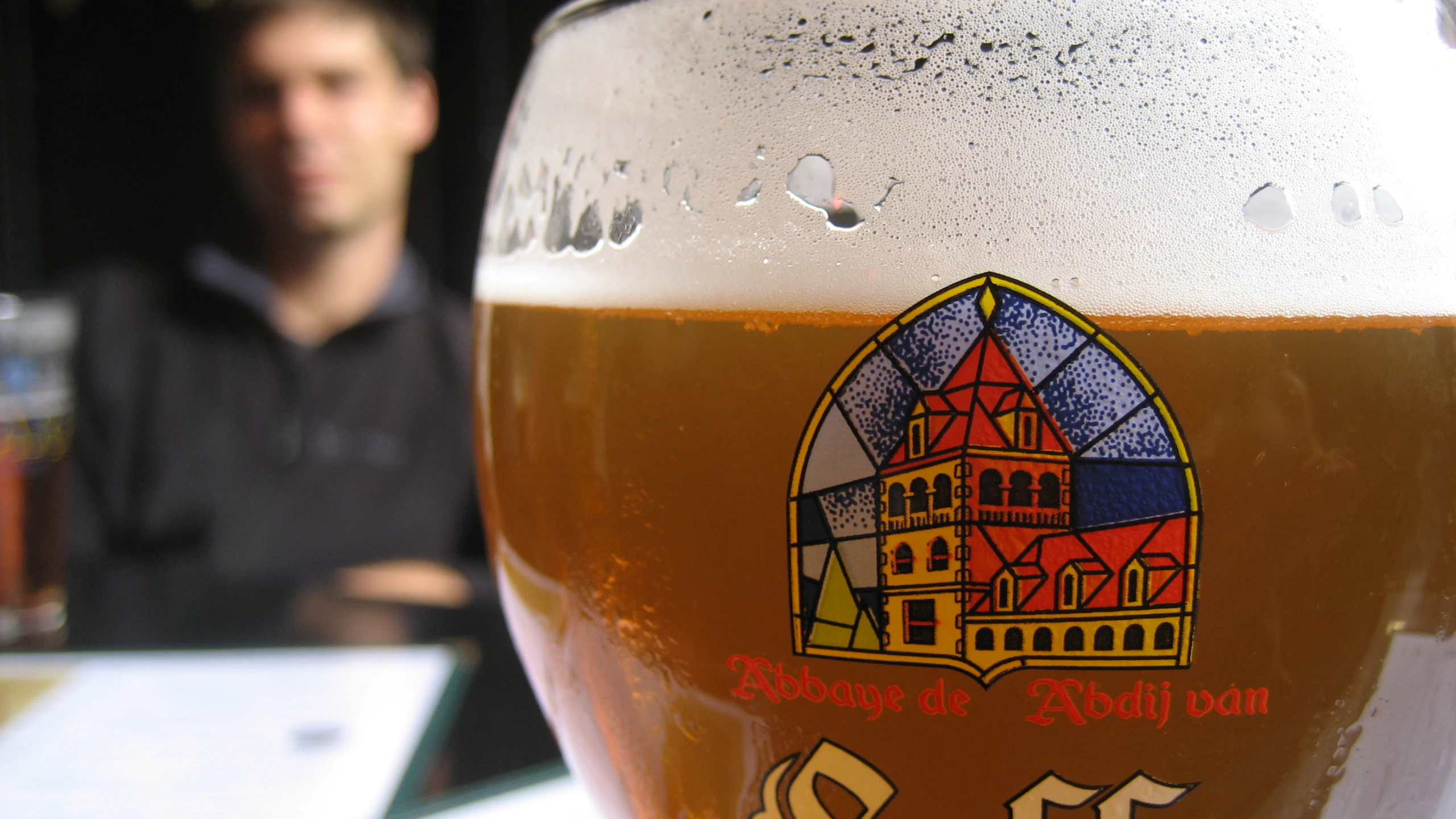 a beer sitting on top of a table