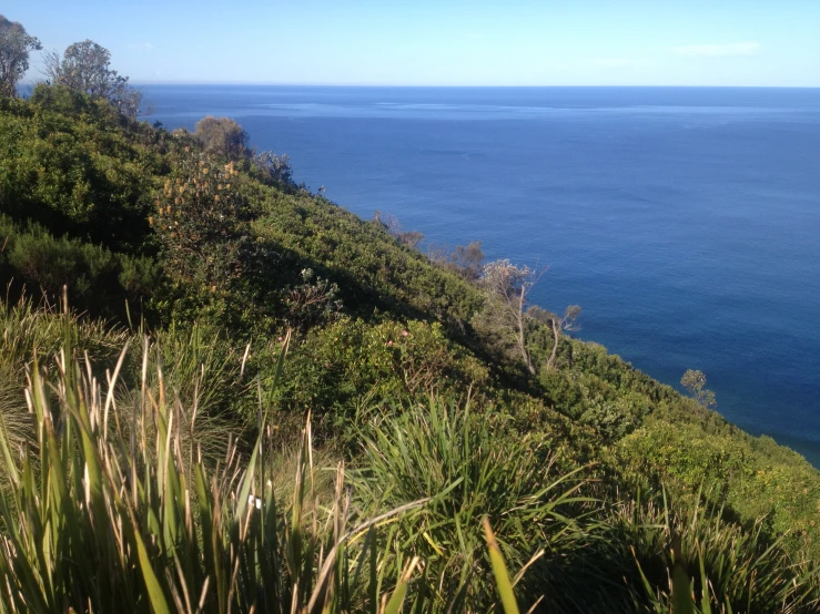 the water is very blue, and that is the steep hill