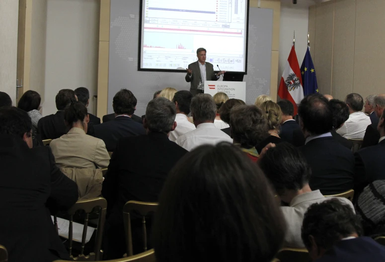 a person giving a presentation to a crowd