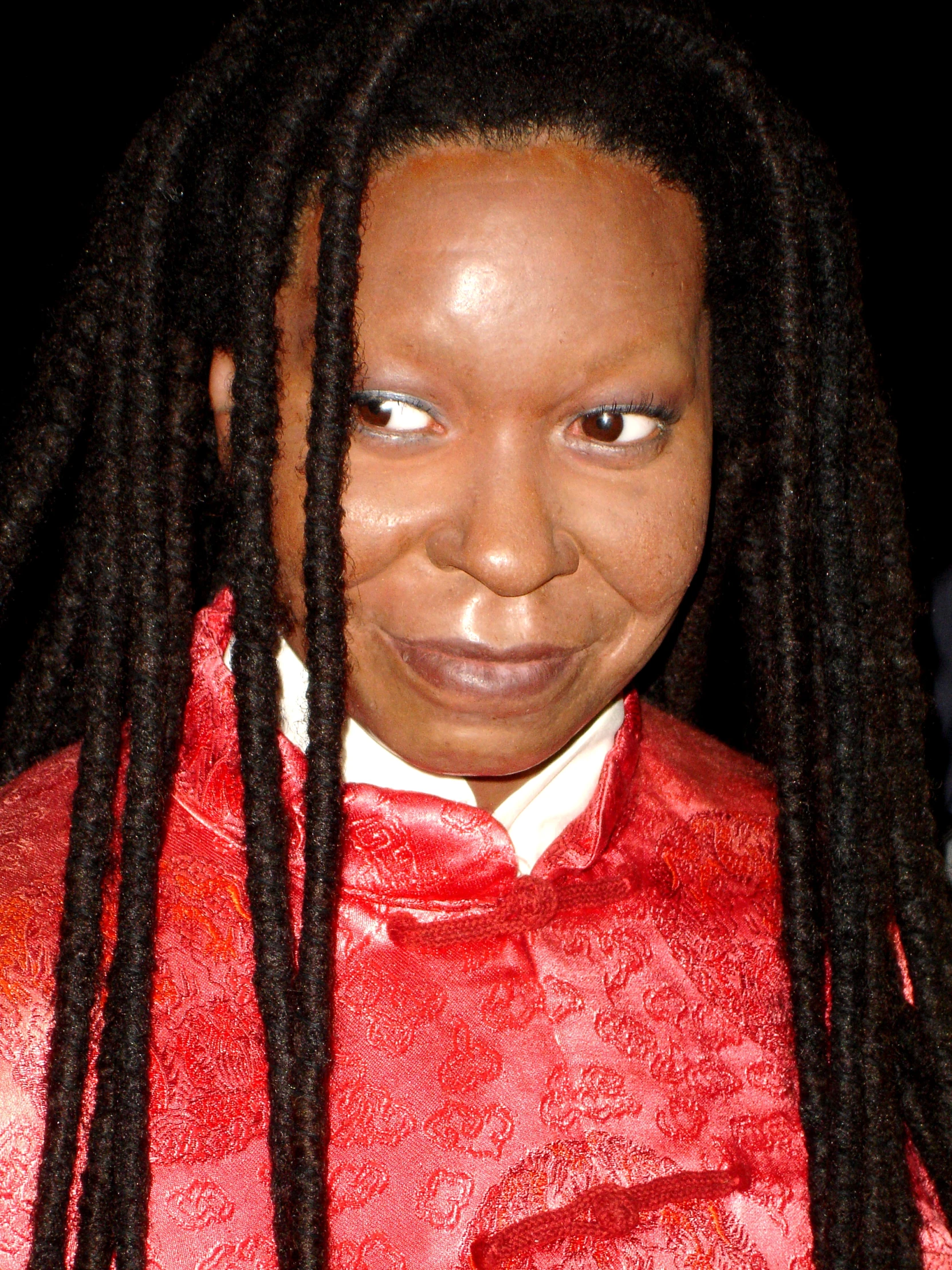 a woman with long hair in a red shirt