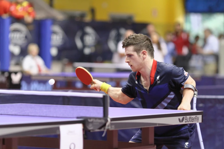 a man playing ping pong on a tennis court