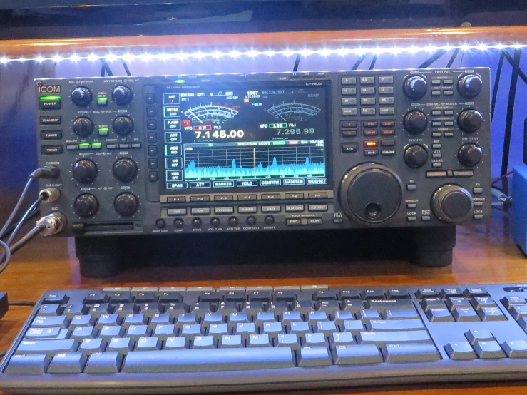 a close up of an analog signal and keyboard on a table