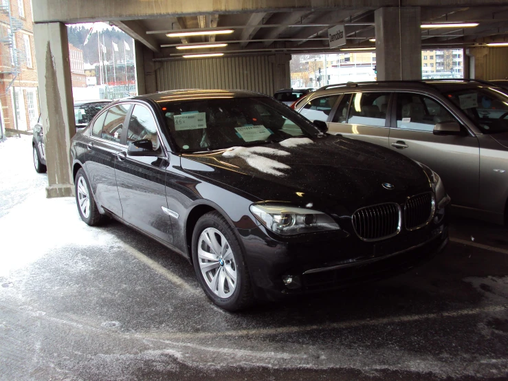 several cars that are parked in the parking garage