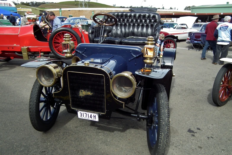 an old car on display at a car show