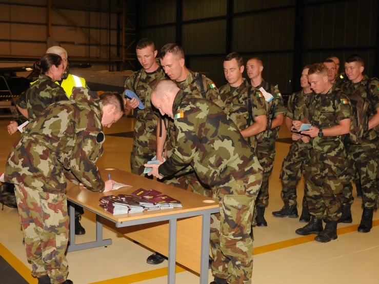 a group of young soldiers and an army man