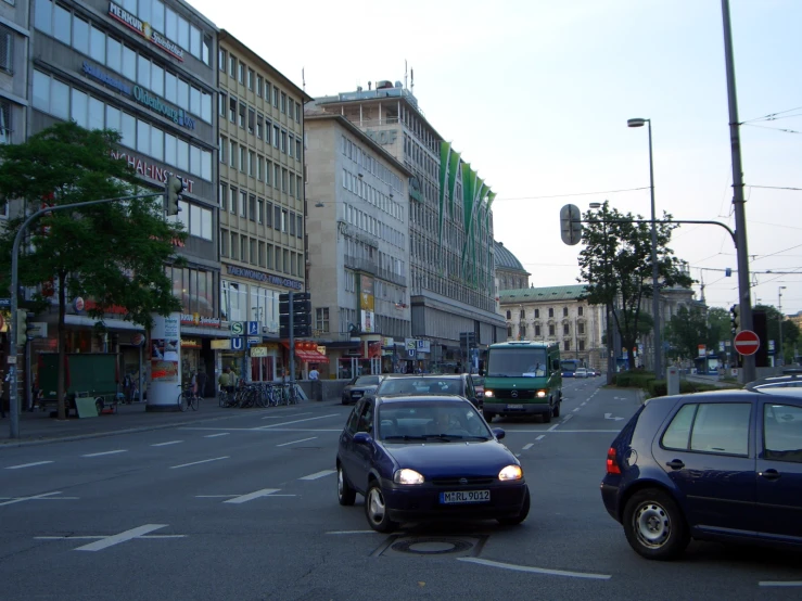 a busy street with cars driving on the opposite road
