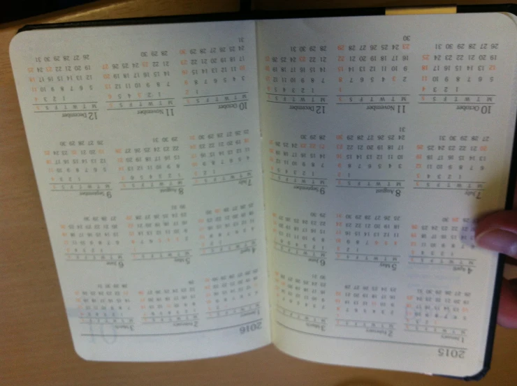 an open book with a calendar in it