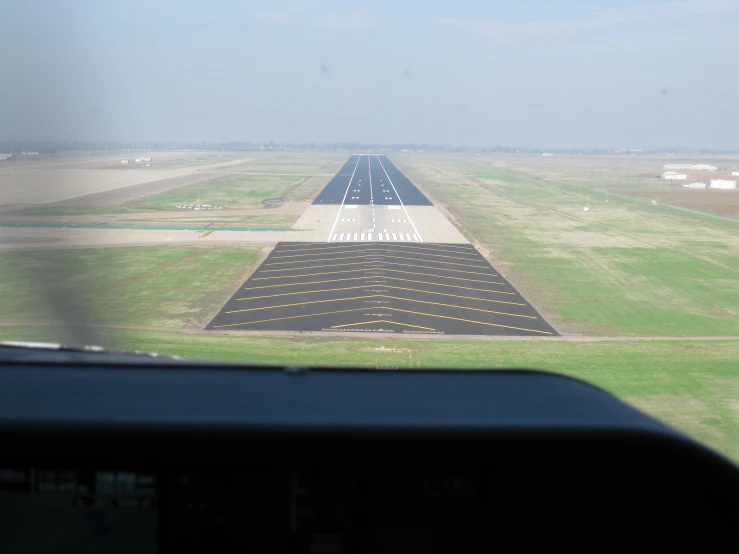 an aerial s of an airplane that is going on the runway