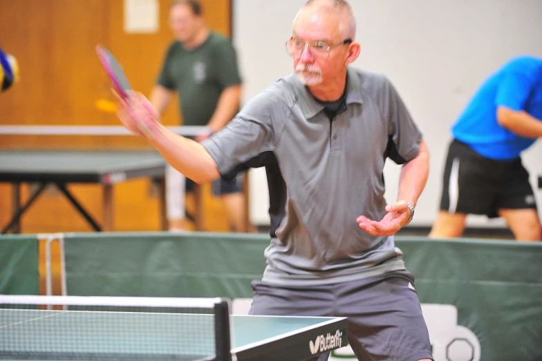 a man that is standing with a racket in his hand