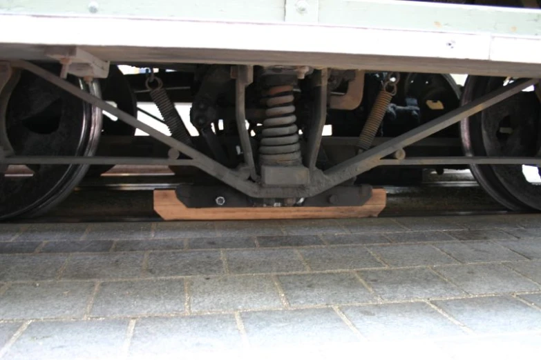 a wheel on a vehicle with large metal springs