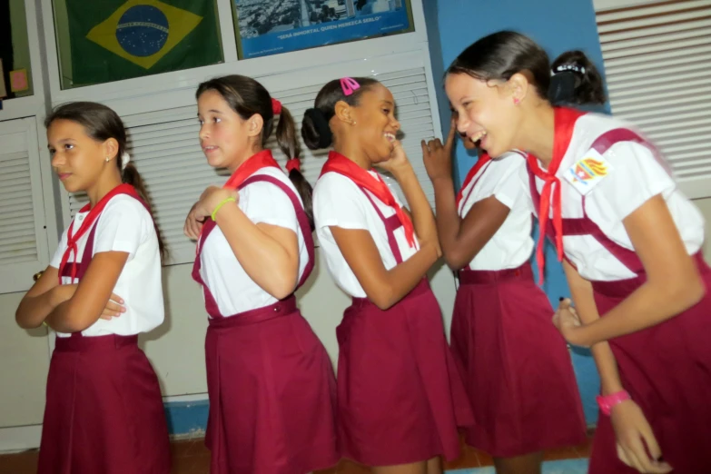 girls in uniforms are lined up to perform