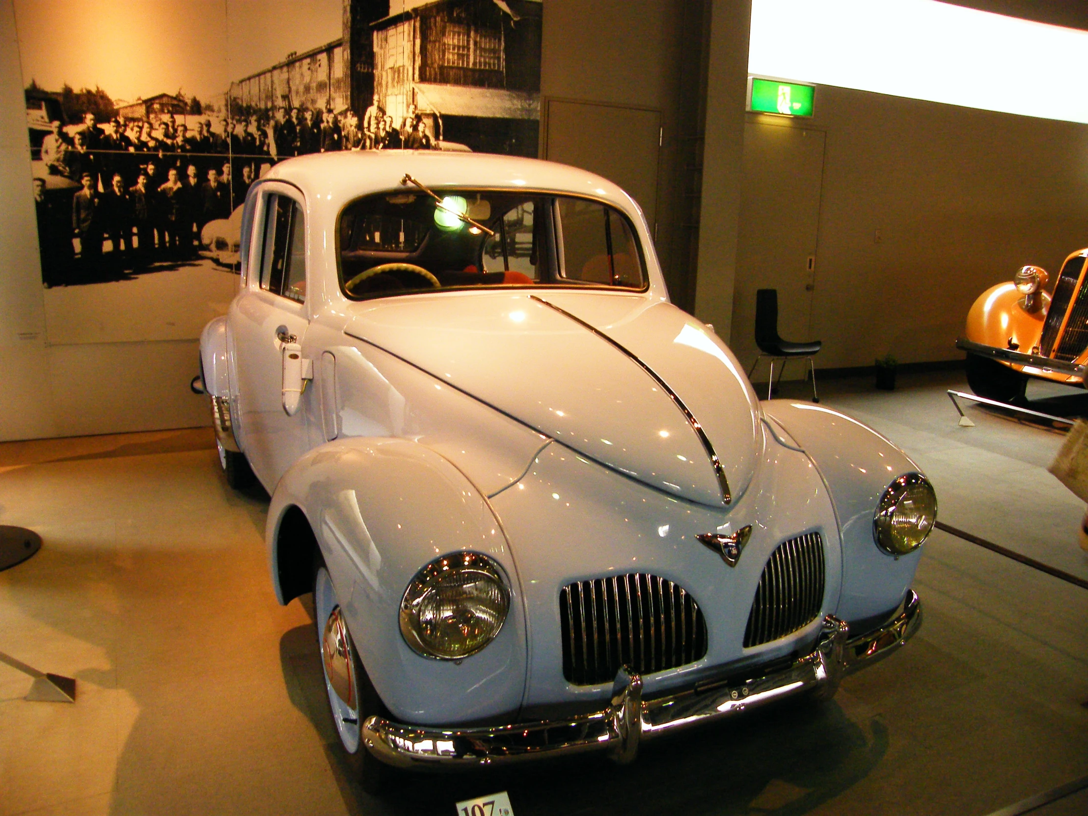 a vintage car on display at the museum