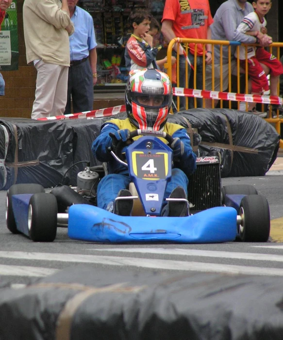 a man is racing his toy car around a curve