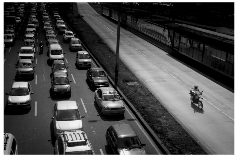 an over head po of cars and motorcycle on a highway