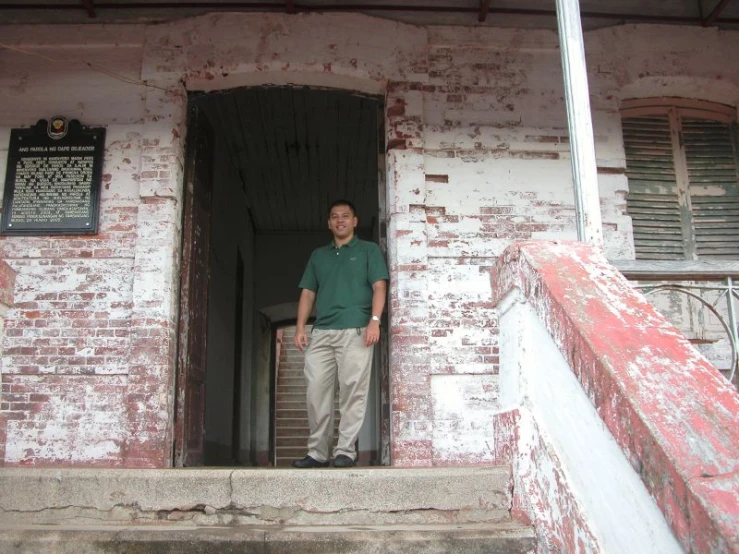 a man is standing in the door way of an old building