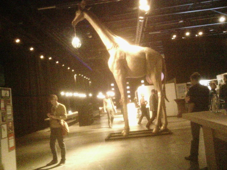 an exhibit that is displaying animals like a giraffe