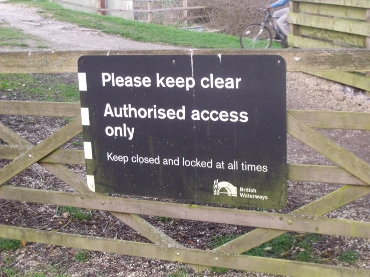 a sign by the fence asking visitors to keep clear