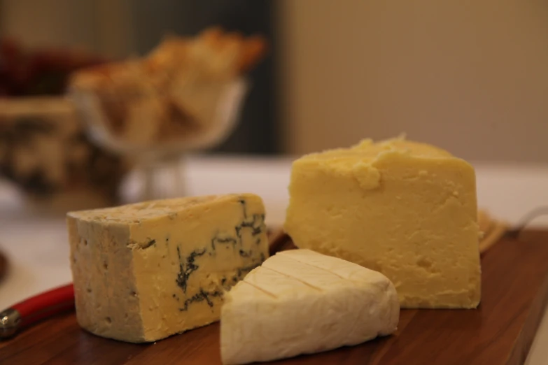 several types of cheese with each cheese wedge removed