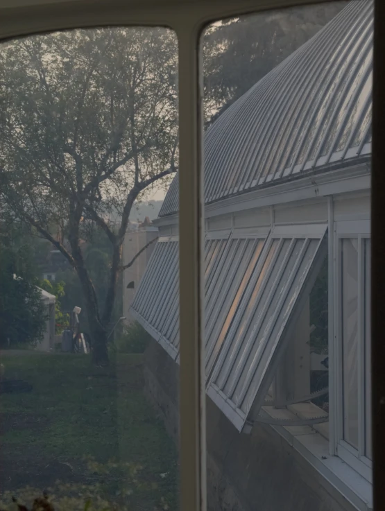 the building's walls are white with a metal roof