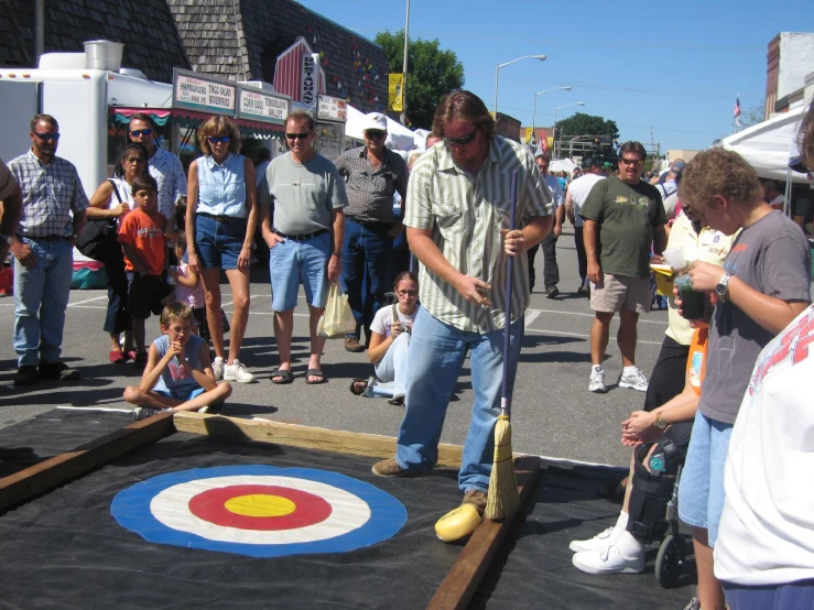 a group of people standing around playing games