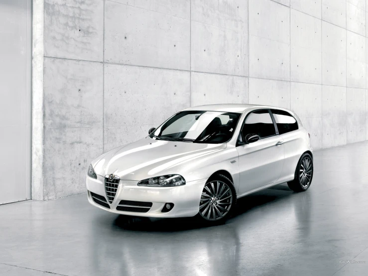 an image of a white car in a parking garage