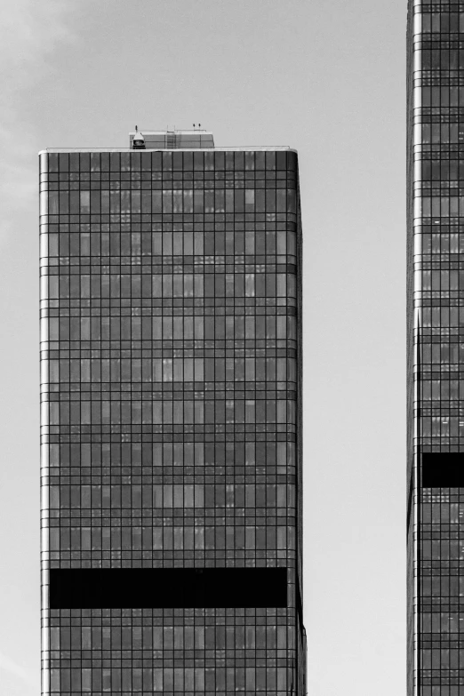 two building with two very tall windows in front of one another