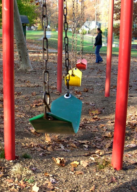an outdoor swing has multiple chains to climb on