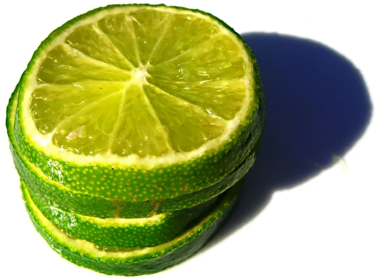a closeup of four cut up limes
