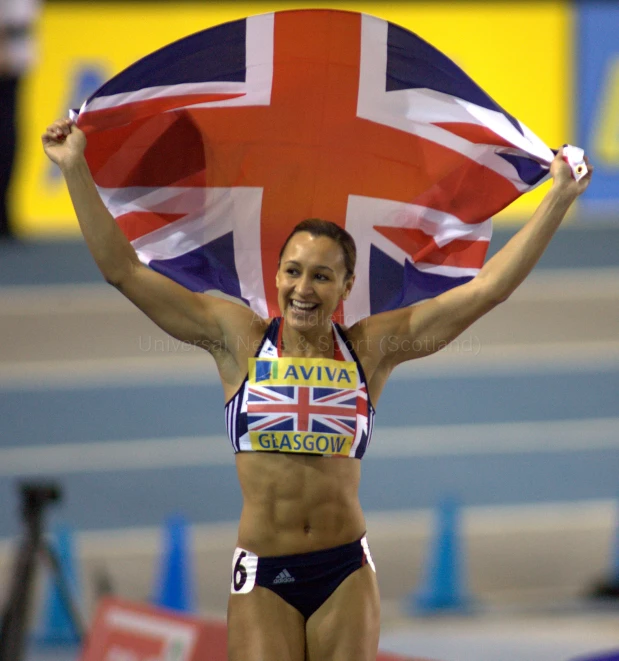 a woman with a british flag behind her head