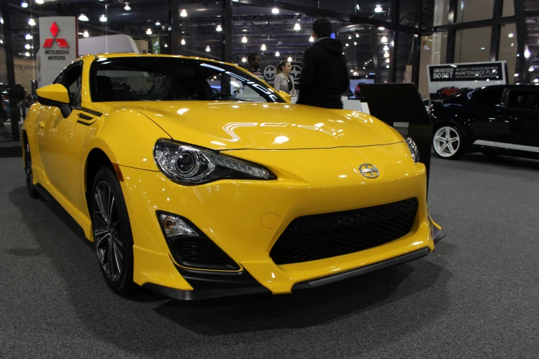 a very pretty car that is on display at a show