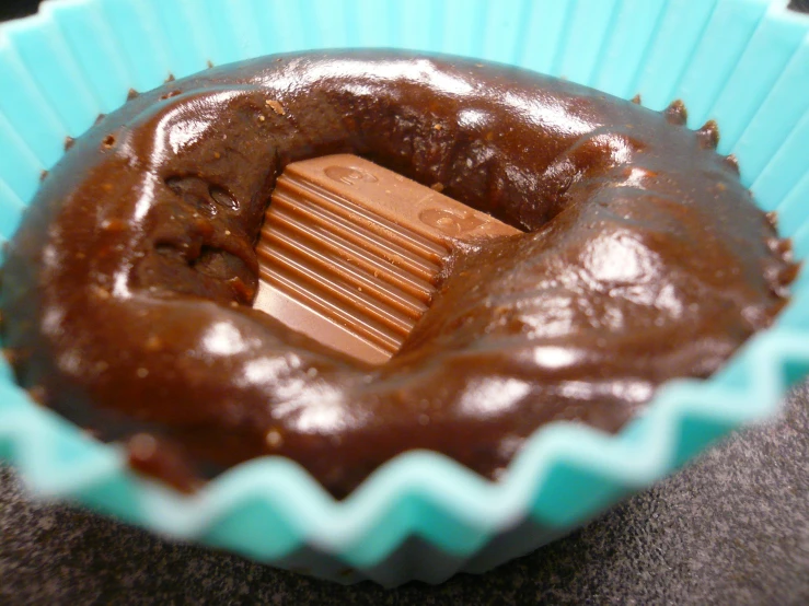 a chocolate candy with a wooden comb in the center of it