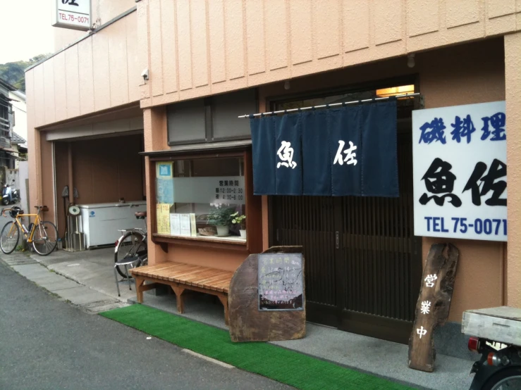 a view of a building with various signage attached to it