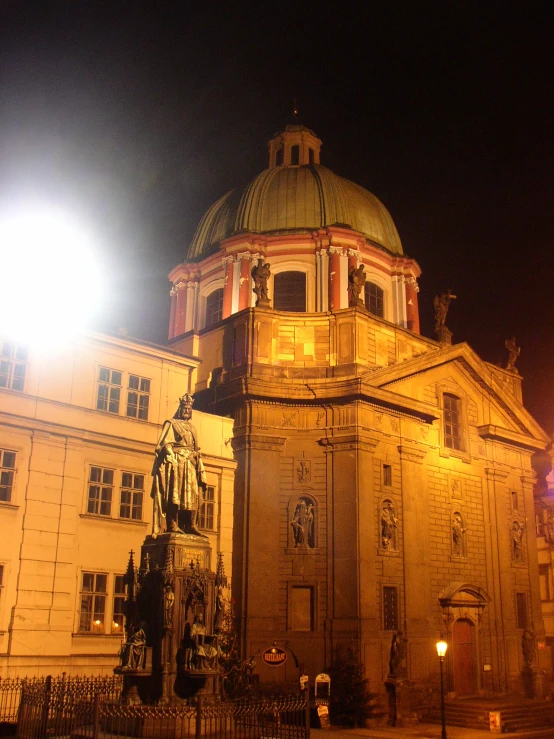 a large building that has a clock tower in front of it