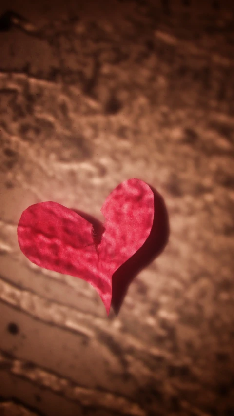 a heart shaped piece of paper on a table