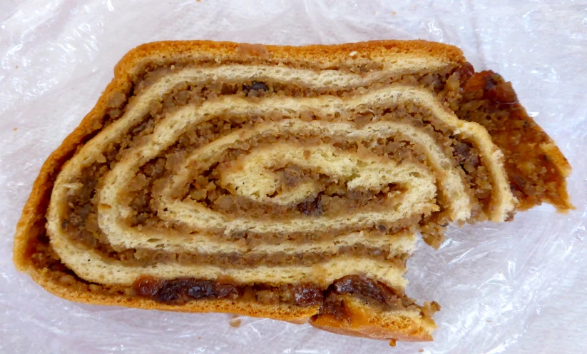 an intricately made pastry piece laying on a plastic bag