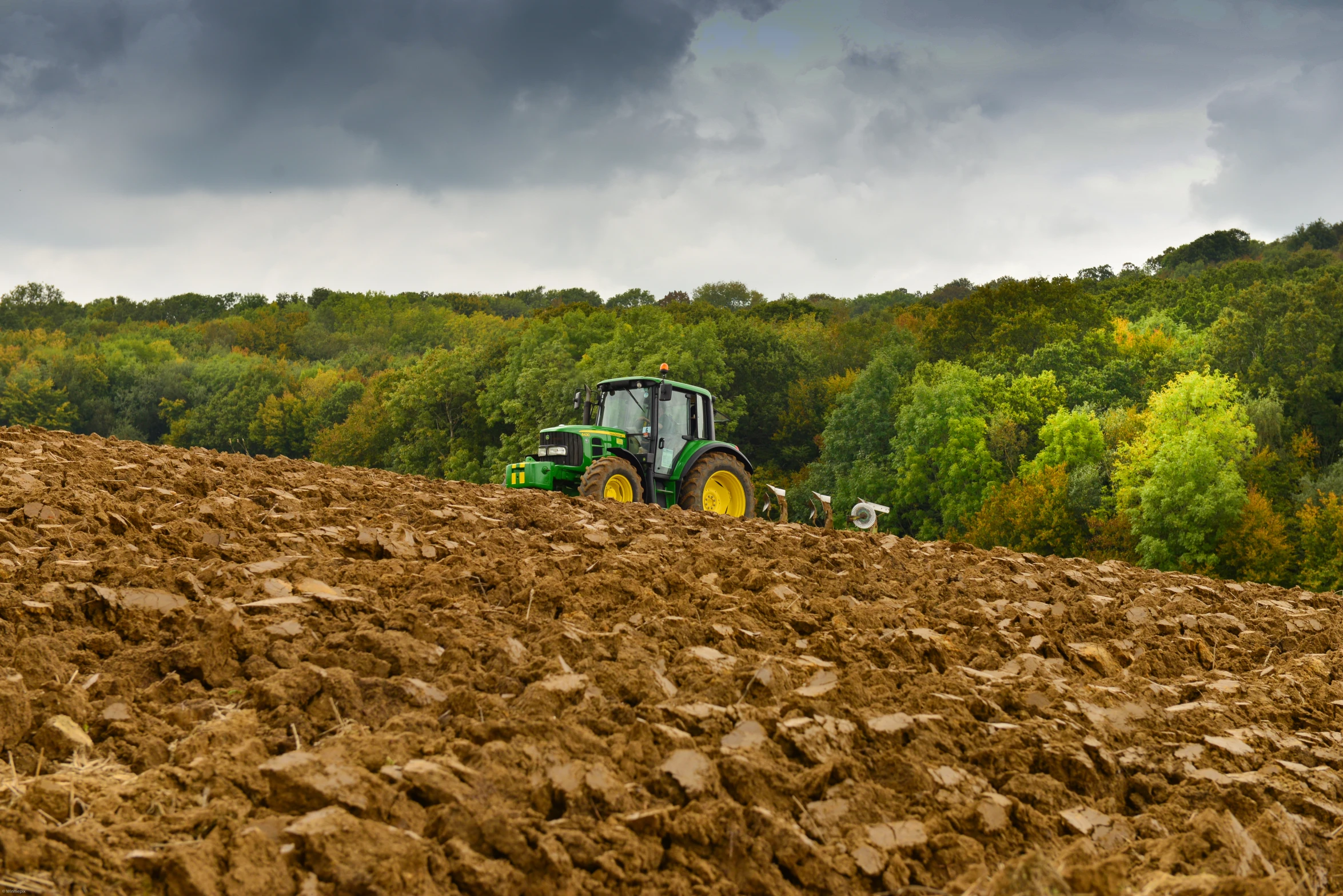 a tractor is parked in the middle of a field