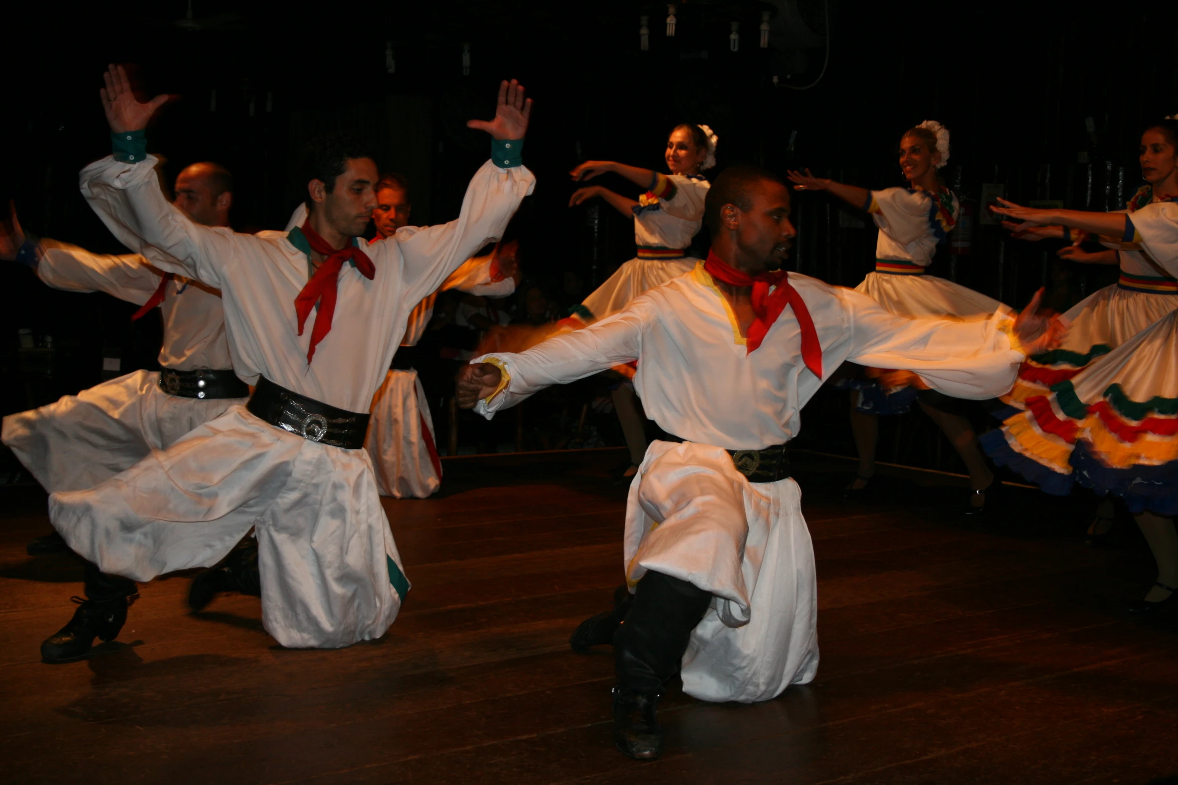 the group of dancers is dressed in traditional mexican garb