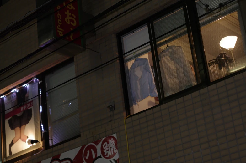 a window with three windows and one light at night