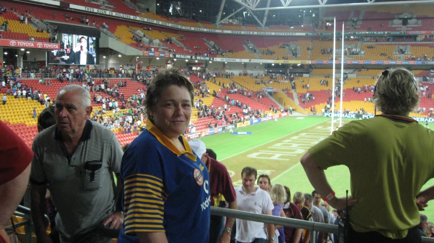 a couple of people standing in front of a crowd