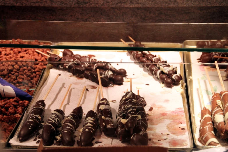 several types of candy sticks are on display