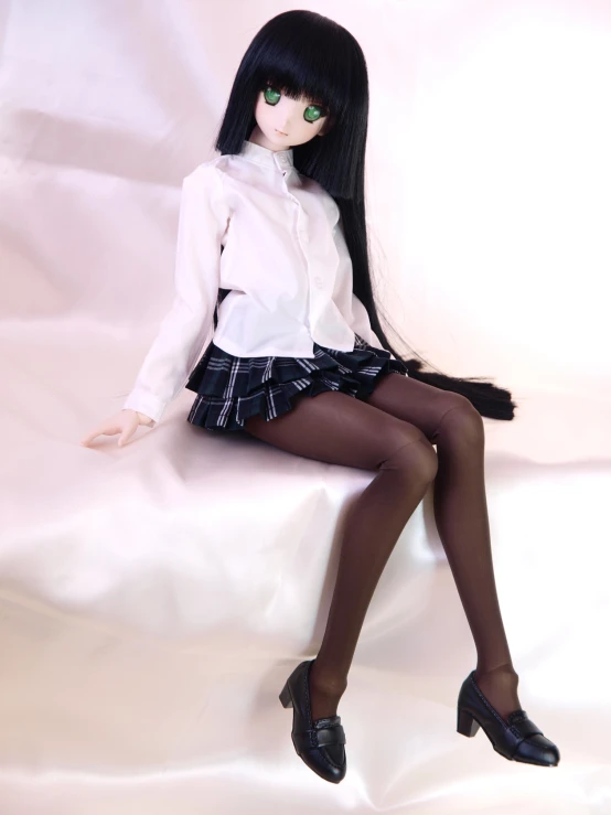 a doll with a black - haired wig wearing black stockings and high heels