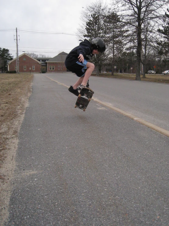 a  jumping in the air with a skateboard