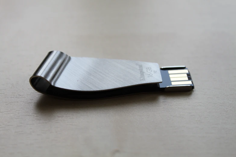 a black and silver usb attached to a metal pad