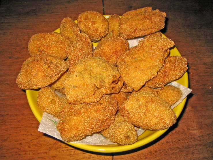 there are fried food on a yellow plate