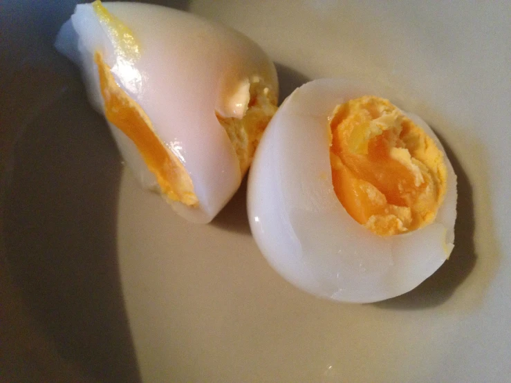 two hard boiled eggs on a table