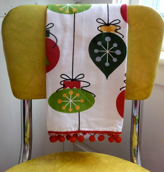 a white towel with christmas decorations on it