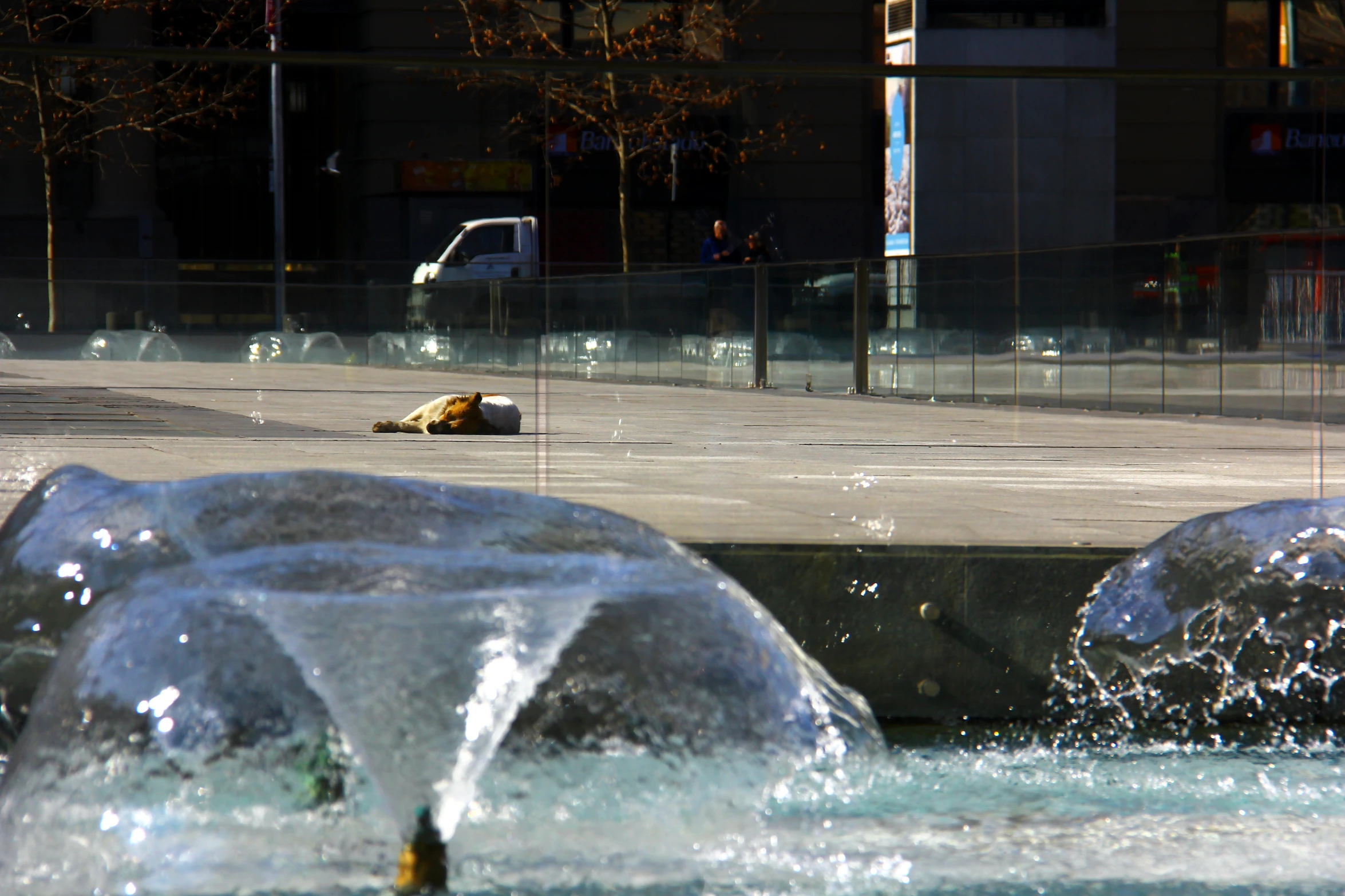 a fountain with two glass balls and water