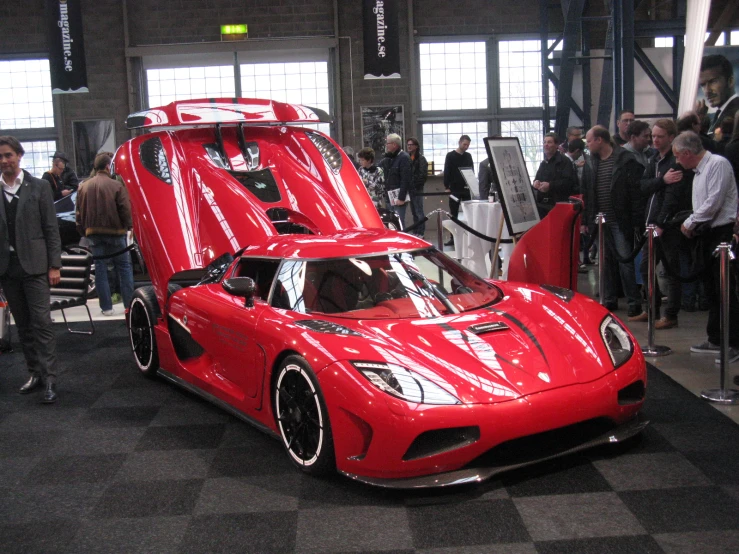 red sports car on display at the motor show