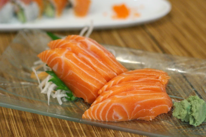 several sushi pieces are arranged on a plate